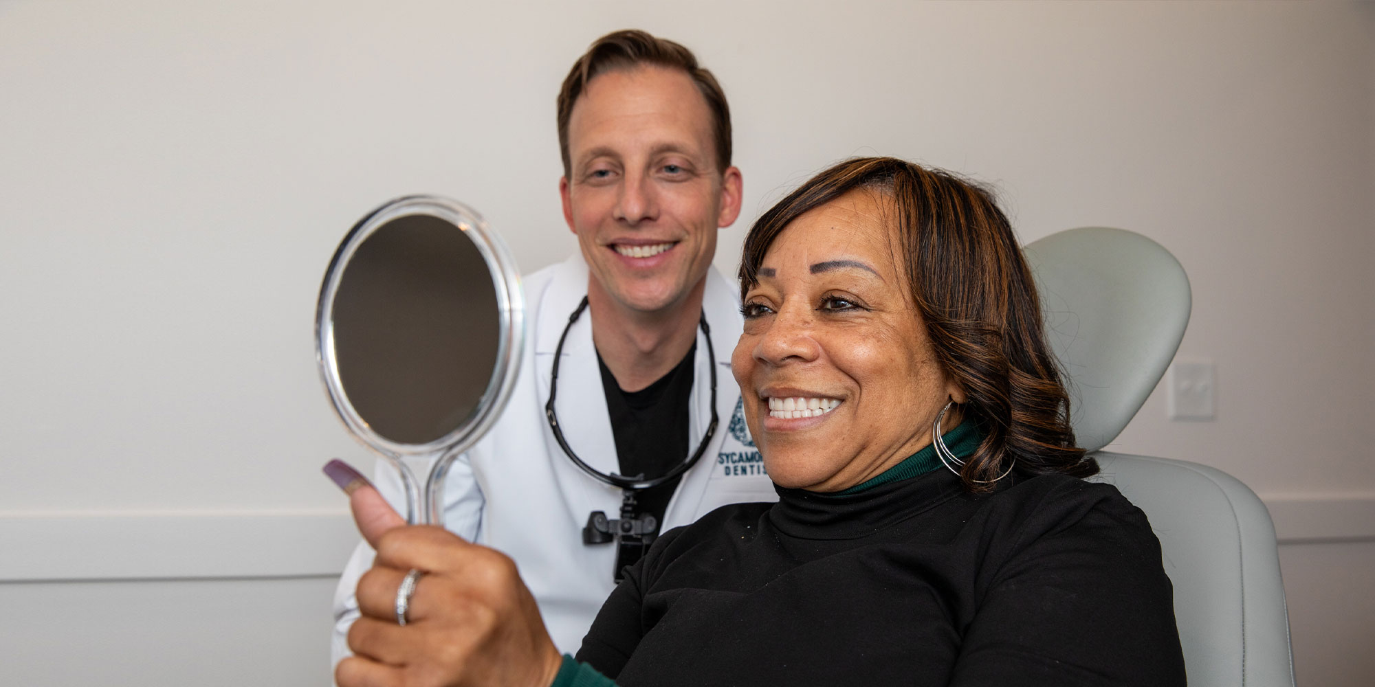 patient smiling brightly after their dental treatment within the dental center