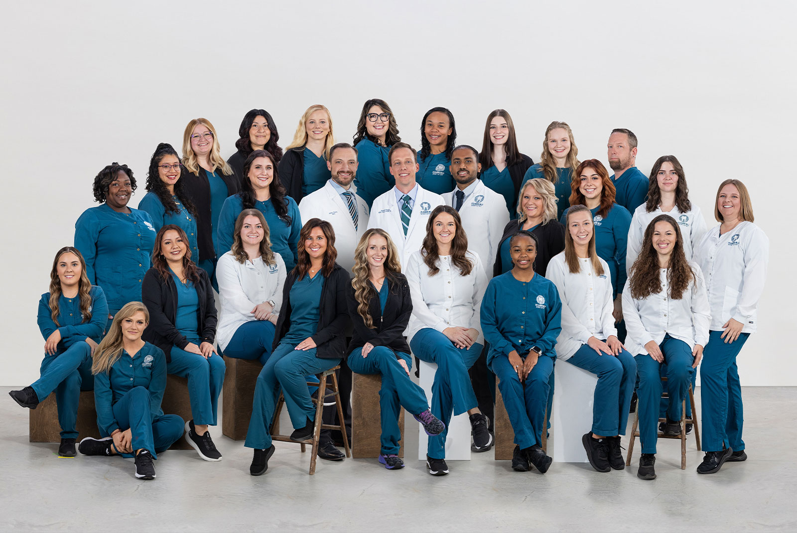 staff member and doctors all taking a picture together for shoot