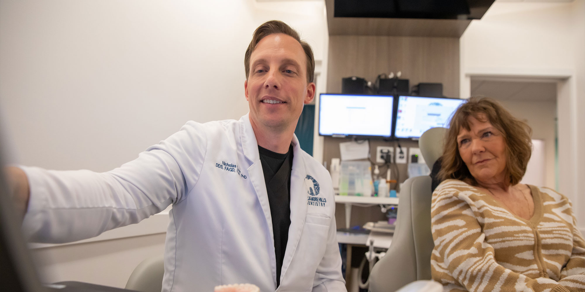 dentist going over dental implants with patient
