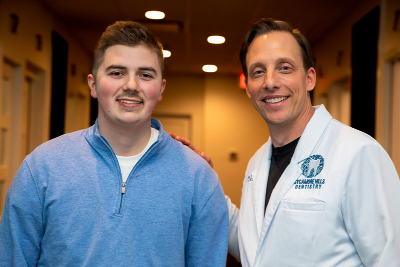 Dentist smiling with Patient