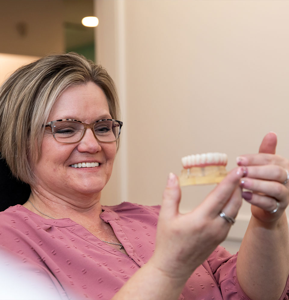Patient smiling looking at a Full arch
