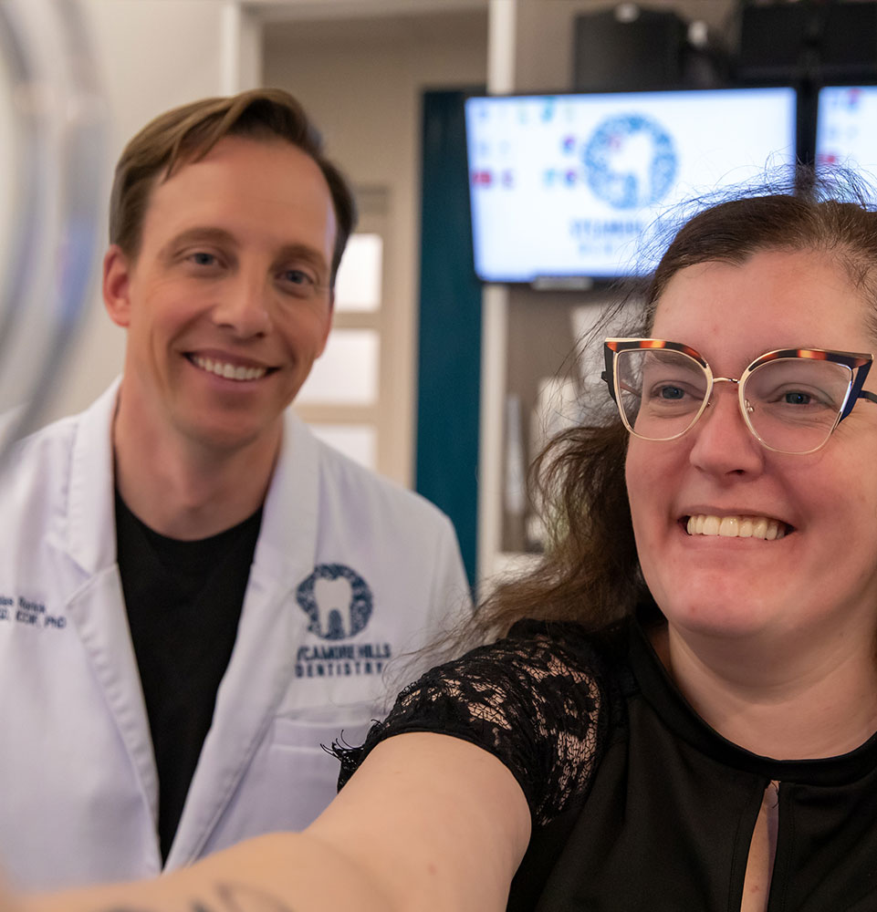 Patient smiling into Mirror
