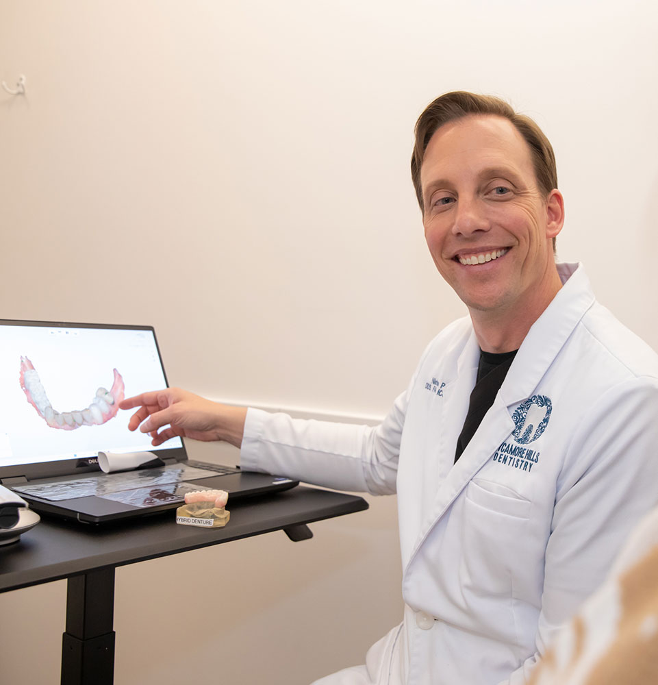 Dentist consulting with patient