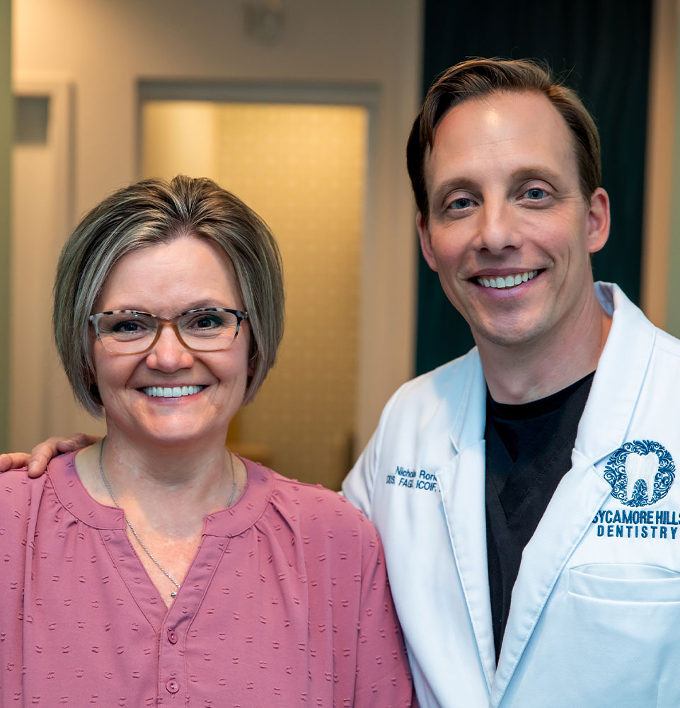 dentist smiling with patient