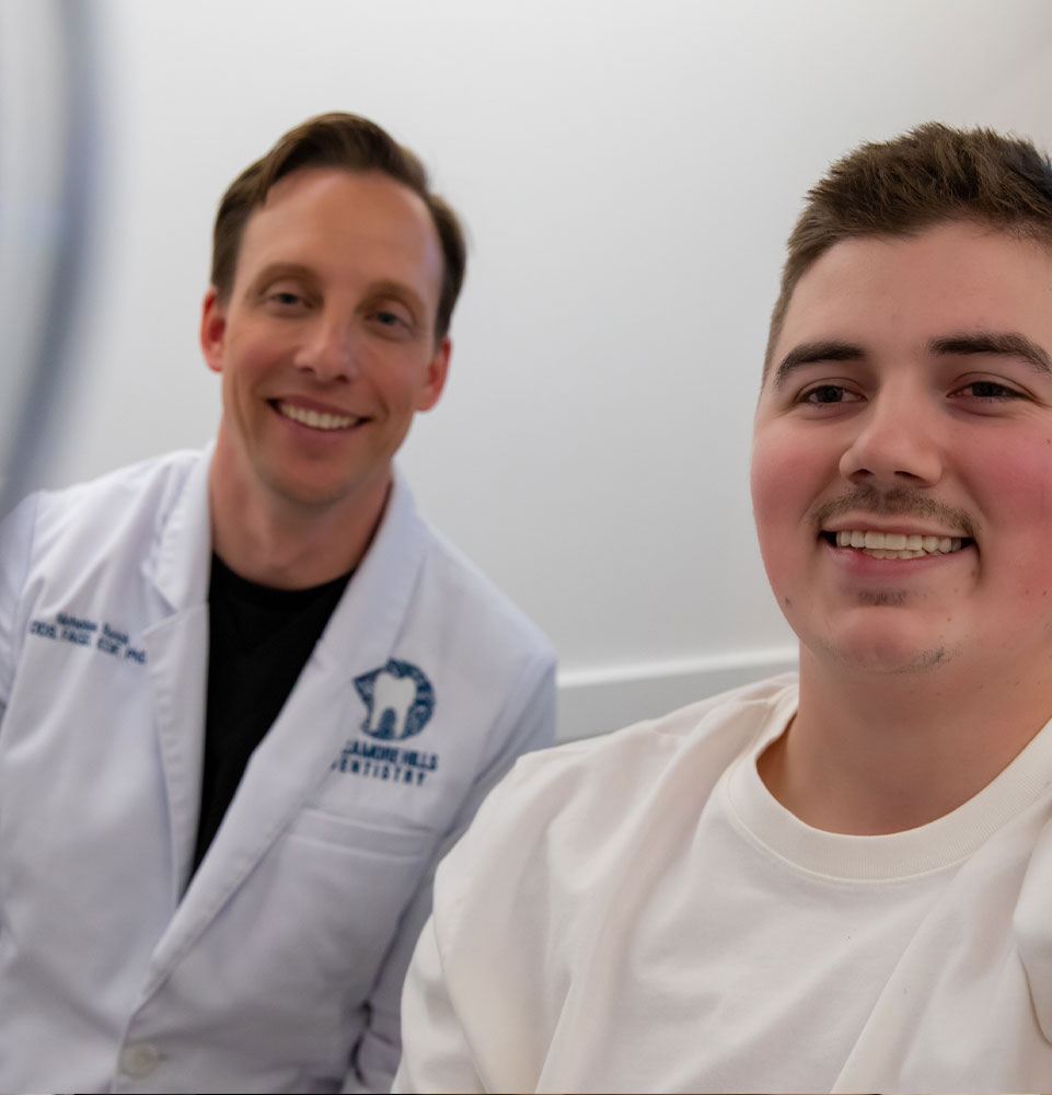 patient looking into mirror after dental procedure